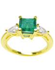 Emerald top view with diamond side ring for Mother's Day gift in yellow gold.
