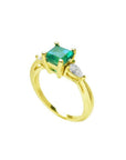 14K yellow gold three-stone ring with a vibrant emerald and two pear-shaped diamonds.