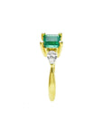The side of this three stone ring for Mother's Day shows the top emerald and side diamond whit the band's ring.