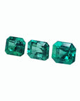 Three stone natural loose emeralds set square, left side tables and crowns visibles