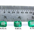 Three stone set emeralds