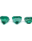 Three emerald-cut natural green emeralds, 1.93 carat matching set from Muzo, Colombia.