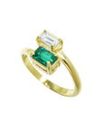 A yellow gold toi et moi ring with emerald and diamond crafted in 18k gold.