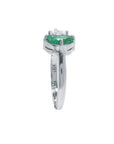 Negative space Toi et Moi ring the emerald showcases fine quality with its distinctive fancy cut, while the geometric trillion diamond creates striking visual contrast.