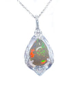Opal silver pendant necklace on a topside view and white background.