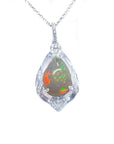 Opal silver pendant necklace on a topside view and white background.