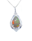 Pear-shaped rainbow Welo Ethiopian opal pendant in 925 sterling silver with cubic zirconia accents.
