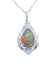 Pear-shaped rainbow Welo Ethiopian opal pendant in 925 sterling silver with cubic zirconia accents.