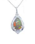 Pear-shaped rainbow Welo Ethiopian opal pendant in 925 sterling silver with cubic zirconia accents.