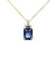 14k gold necklace with an emerald-cut blue sapphire pendant and three accent diamonds.