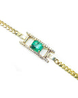 Gold bracelet with a genuine square emerald with diamonds accent on a topside view.