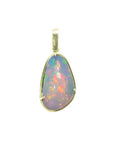 Natural Ethiopian opal pendant with vivid rainbow flashes in 14K yellow gold.