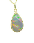 Teardrop Ethiopian Welo opal pendant with colorful flashes, set in 14K solid yellow gold.