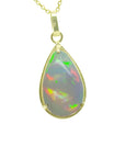 Teardrop Ethiopian Welo opal pendant with colorful flashes, set in 14K solid yellow gold.