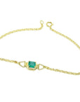 14K yellow gold solitaire bracelet with a deep green Colombian emerald.