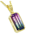 2.50 ct. watermelon tourmaline solitaire pendant in 14K yellow gold, showcasing pink and blue-green hues.
