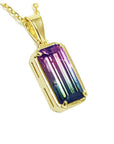 2.50 ct. watermelon tourmaline solitaire pendant in 14K yellow gold, showcasing pink and blue-green hues.