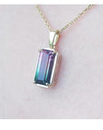 2.50 ct. watermelon tourmaline solitaire pendant with pink and blue-green hues in 14K yellow gold.