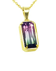 2.50 ct. watermelon tourmaline pendant with pink and blue-green hues in 14K yellow gold.