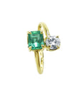 A 18k yellow gold You and Me ring design with a natural colombian emerald and diamond.