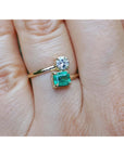 Women's natural Colombian emerald and diamond ring You and Me design, also known as a Toi et Moi ring, in 18k yellow gold.