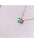 Bridal's emerald solitaire necklace tulip design square emeral-cut from Muzo Colombian mines prong set in 14k yellow gold