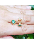 Colombian emerald tulip stud earrings in 14K yellow gold with secure push backs.