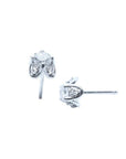 Pair of 14K white gold tulip stud earrings with 0.59 ct. round natural diamonds and accent diamond petals.