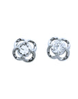 Pair of natural diamond tulip stud earrings in 14k white gold, top side view.