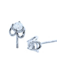 A pair of natural diamond tulip stud earrings, top and side view profiles,