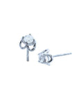 Pair of natural diamond tulip stud earrings in 14K white gold with round cut diamonds.
