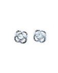 Pair of natural diamond tulip stud earrings in 14k white gold, top side view.