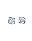 Pair of natural diamond tulip stud earrings in 14k white gold, top side view.