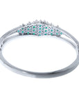 14k white gold bangle bracelet with round Colombian emeralds and diamonds.