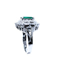 Vintage 2.40 ct Colombian emerald ring in 14K white gold with diamond accents.