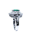Vintage 2.40 ct Colombian emerald ring in 14K white gold with diamond accents.