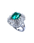 Vintage 2.40 ct Colombian emerald ring in 14K white gold with diamond accents.