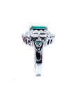 Vintage 14K white gold ring with a 2.40 ct bluish-green Colombian emerald and diamond accents.