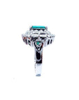 Vintage 14K white gold ring with a 2.40 ct bluish-green Colombian emerald and diamond accents.
