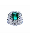 A vintage authentic Colombian emerald ring and accent diamonds in white gold.