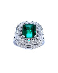 Vintage 2.40 ct Colombian emerald ring in 14K white gold with diamond accents.