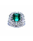 Vintage 2.40 ct Colombian emerald ring in 14K white gold with diamond accents.