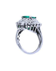 An underside view of this vintage emerald ring displaying the gallery and band ring