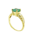 Vintage 14K yellow gold ring with a medium bluish-green emerald and accent diamonds.