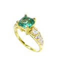 Vintage 14K yellow gold ring with a square-cut Colombian emerald and sparkling accent diamonds.