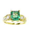 Vintage 14K yellow gold ring with a square emerald and round accent diamonds.
