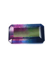 A rectangular emerald cut natural watermelon tourmaline from Brazil displaying the top table and crown facets.