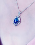 Multicolor Welo Ethiopian black opal pendant in ornate sterling silver with CZ accents on a silver chain.