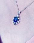 Multicolor Welo Ethiopian black opal pendant in ornate sterling silver with CZ accents on a silver chain.