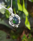 Multicolor Welo Ethiopian black opal pendant in ornate sterling silver with cubic zirconia accents.